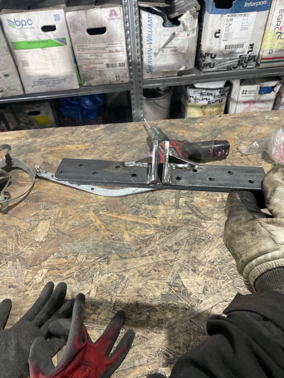 Fabricating the bracket in the workshop: drilling